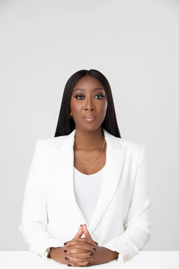Bola Adepoju seated in the studio